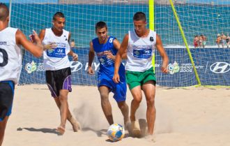 Playing soccer on the beach in Brazil