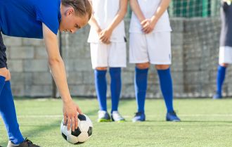 individual taking curling free kick